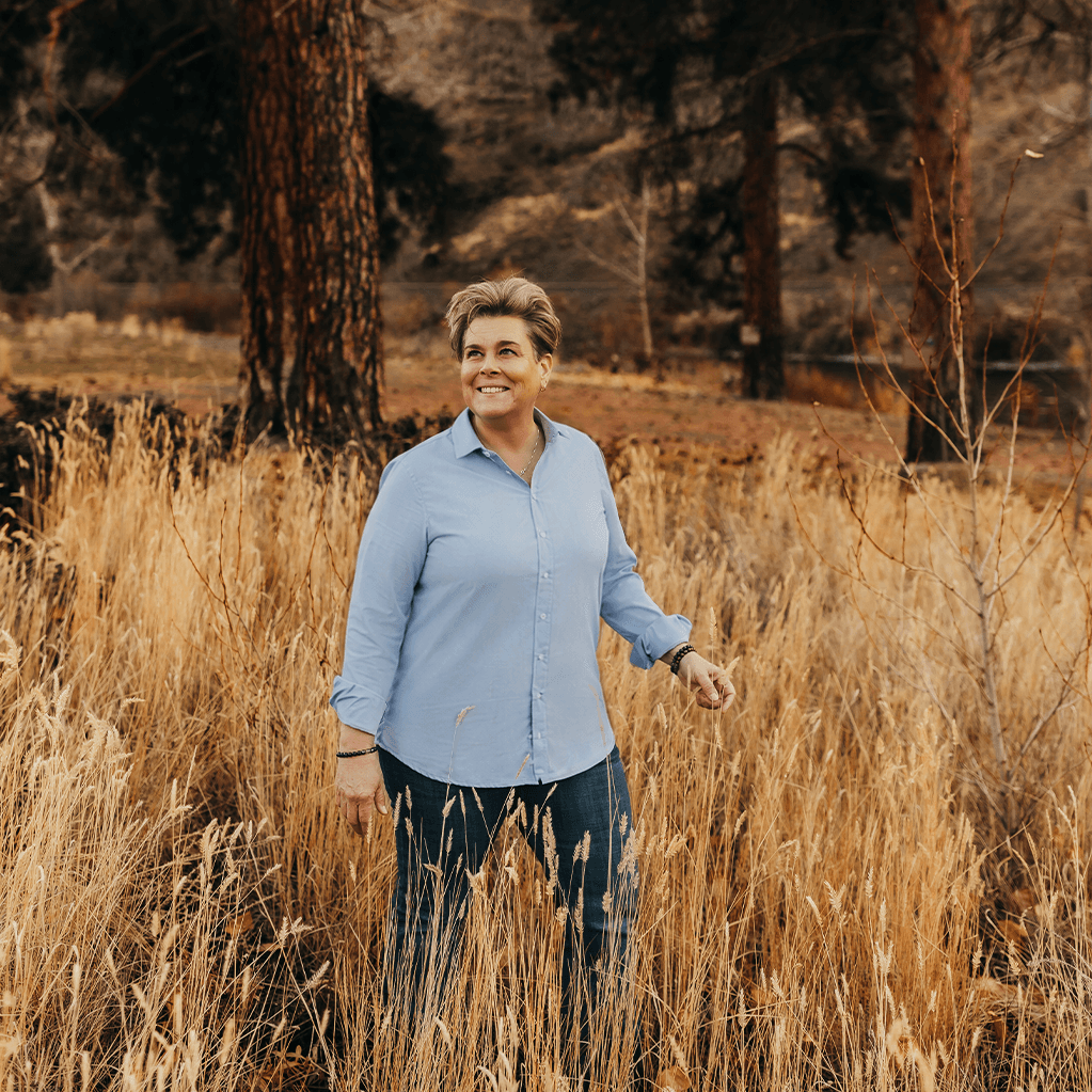 Jen Huber in a field of tall grass